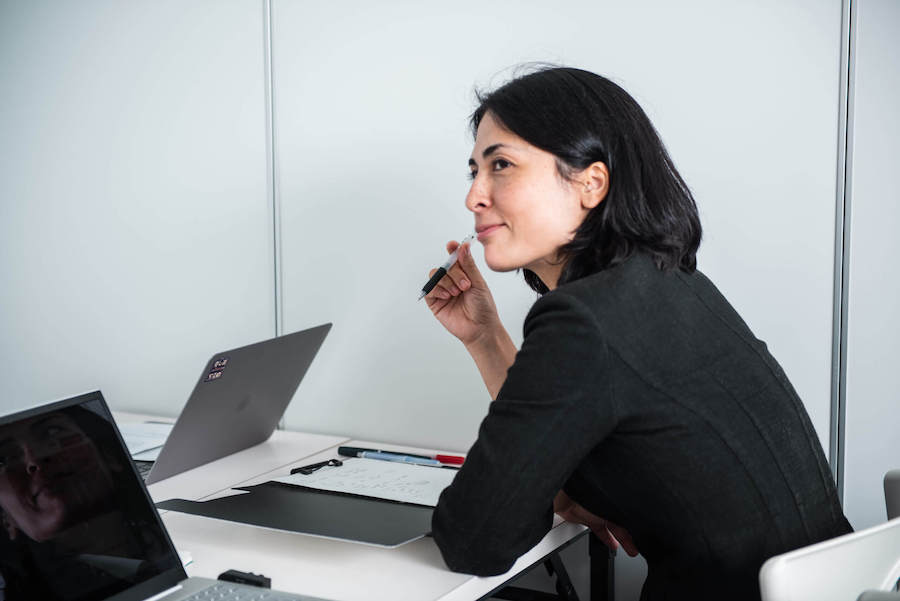 Woman sitting in front of computer